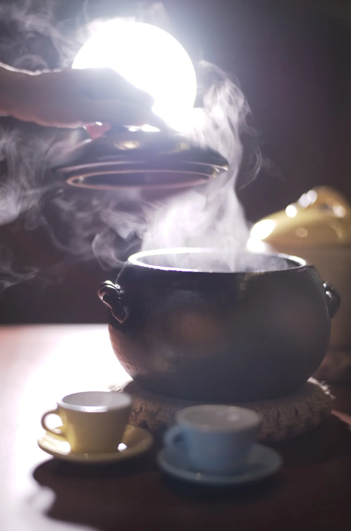A Harakama kamameshi set — rice pot with seasonal garnish and condiments